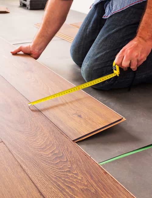 Person replacing flooring.