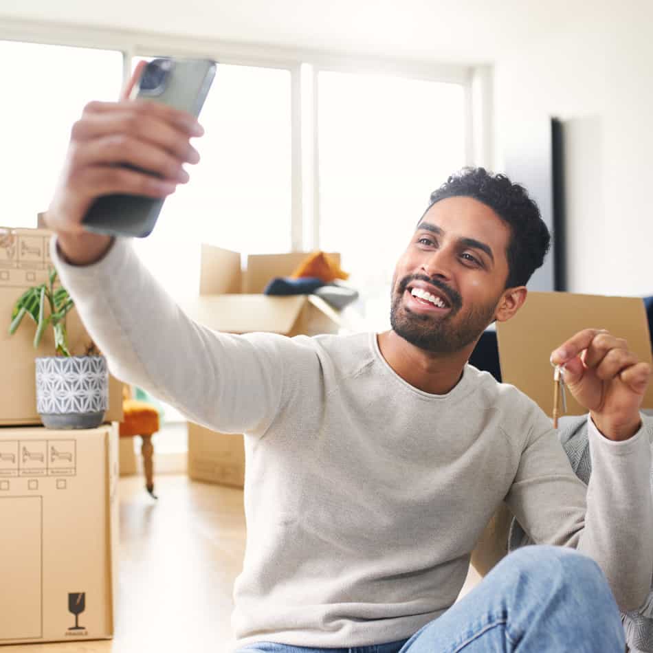Guy sitting in new home.